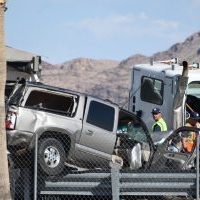 Las Vegas, Nevada / United States -  July 25, 2019: Traffic Collision between trailer truck and SUV on Las Vegas Blvd. North, adjacent to Las Vegas Speedway, North of Nellis AFB Truck and SUV were in major collision, causing road closure and major response by Nevada State Troopers.  The road was closed for several hours while Nevada State Troopers made an investigation.  This was at the intersection of Las Vegas Blvd. North and Checkered Flag Lane.